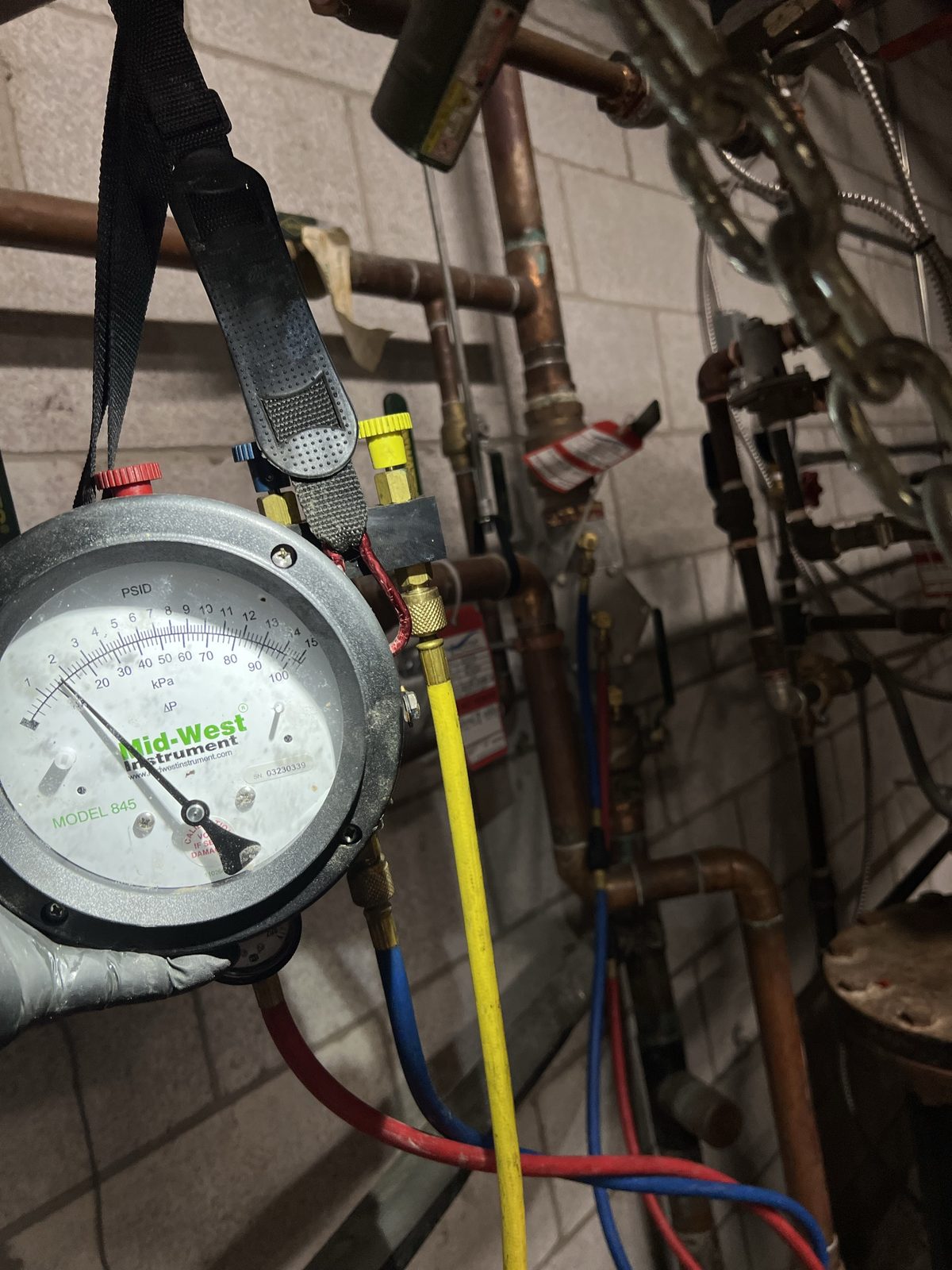 A test gauge connected to a backflow assembly