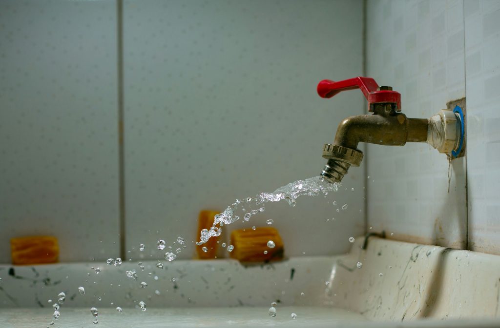 Water shooting out of a spigot, this can happen unexpectedly if you do not conduct annual testing of your backflow device. Image Credit: Ian Talmacs