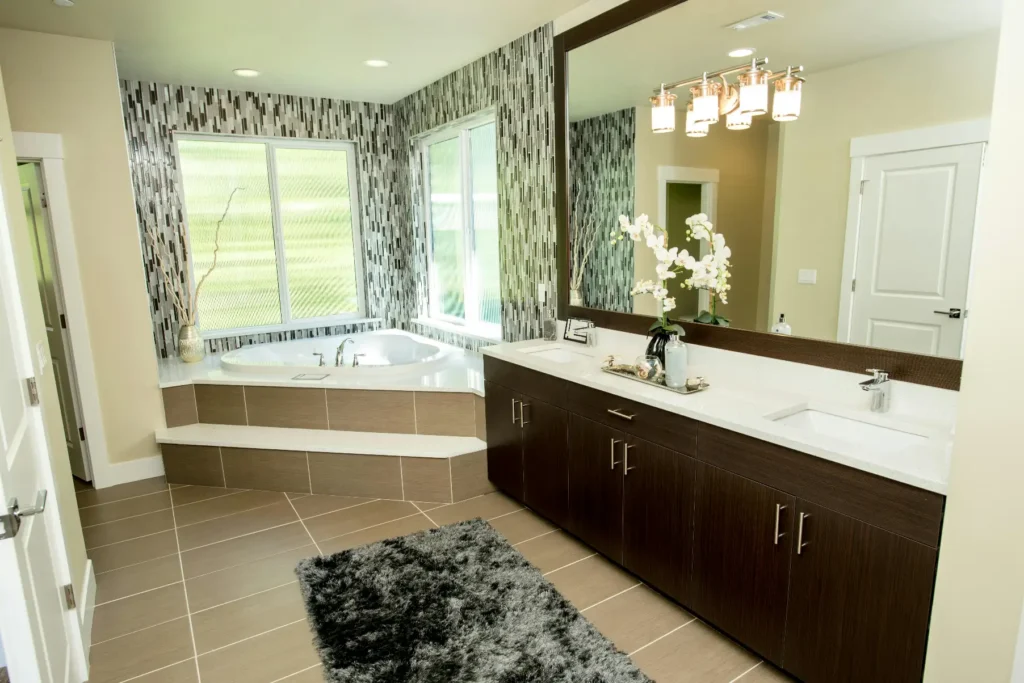 Luxury bathroom with double vanity, large mirror and corner bathtub